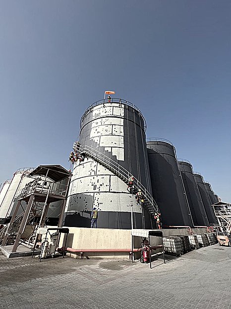 Grain silo cluster with rope-access team